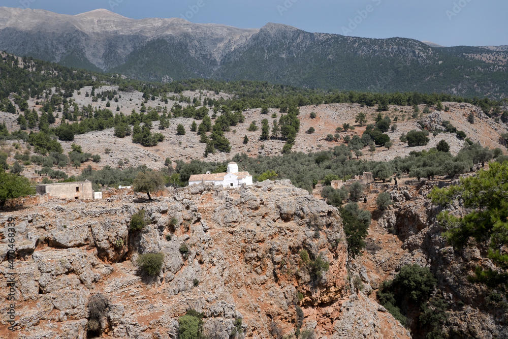 Crete, the gorge of Aradena, wide landscape with a small church above the Aradena Gorge. On the background the White Mountains. Sfakia, Chania. Greece
