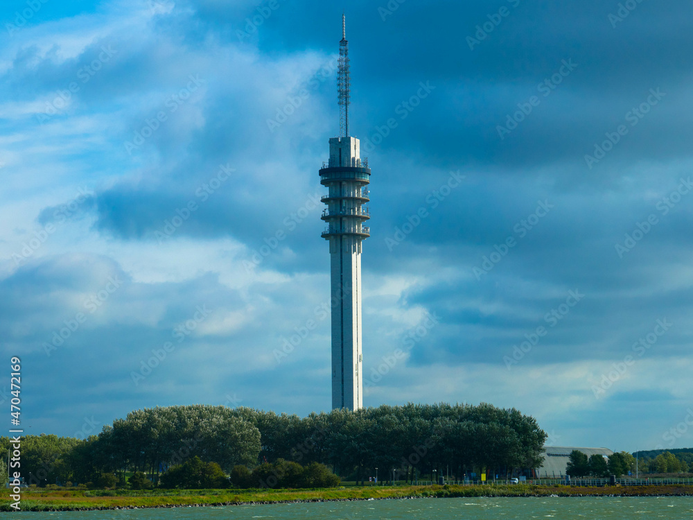 Communication Tower of a radio mast, tall structure designed to support antennas for telecommunication and broadcasting, television.  Now used as a computer data center. Lelystady, Netherlands.