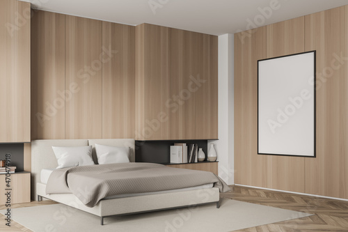 Wooden bedroom interior with bed  linens and mockup poster