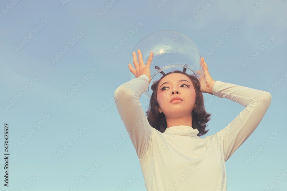 Beautiful Retro space girl holding helmet space. Beautiful Retro space girl holding helmet space.