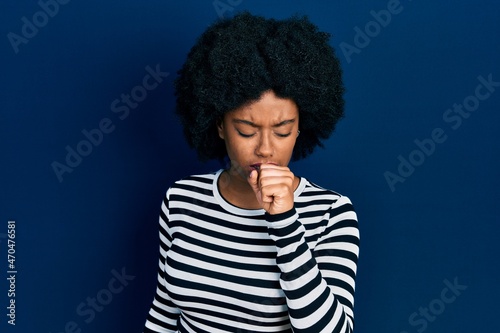 Young african american woman wearing casual clothes feeling unwell and coughing as symptom for cold or bronchitis. health care concept.