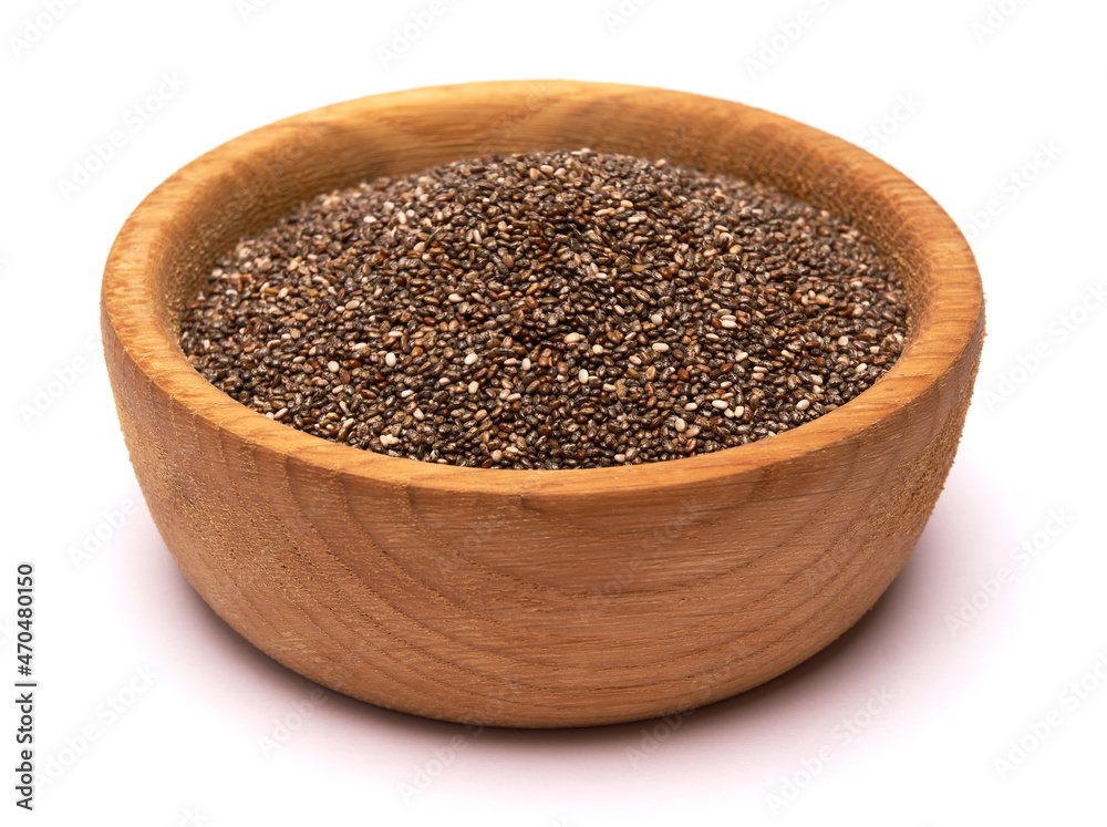 Wooden bowl of organic natural chia seeds close-up isolated Wooden bowl of organic natural chia seeds close-up isolated