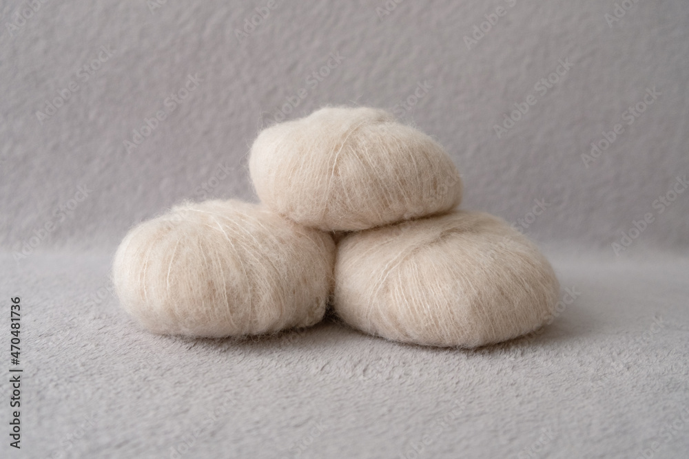 Three balls of soft alpaca silk yarn in beige color Three balls of soft alpaca silk yarn in beige color