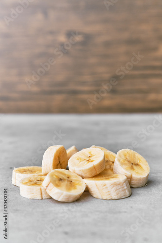 Photo of banana slices on a concrete surface