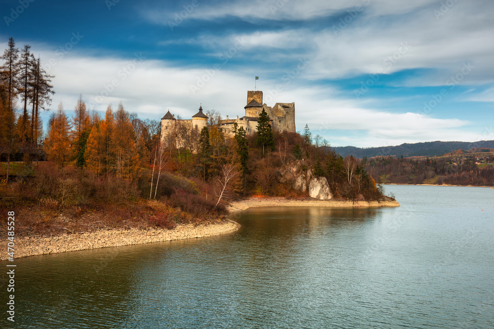 Medieval Castle in Niedzica with a reflection in the Czorsztyn Lake. Poland