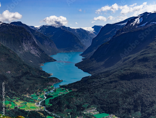 Scenic view on beautiful fjord, town and Norwegian mountains