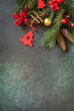 Christmas mockup with fir tree Christmas presents on a dark green stone background. Preparation for celebration xmas. Copy space.