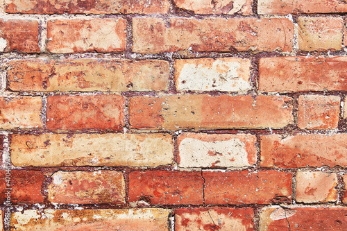 Brick wall texture with cracked tiles and cement. Classic brickwall surface background