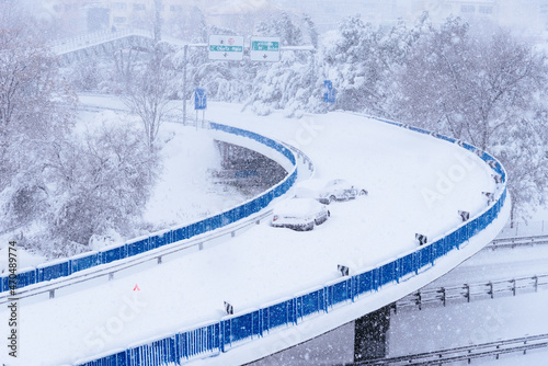 View of a highway in the city covered in snow during heavy snowfall with trapped vehicles. Storm Filomena in Madrid. M-30, Costa Rica area photo