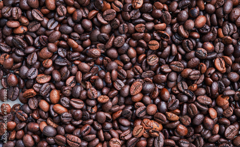 Brown and black coffee beans. Roasted arabic espresso coffee grains. Brown and black coffee beans. Roasted arabic espresso coffee grains.