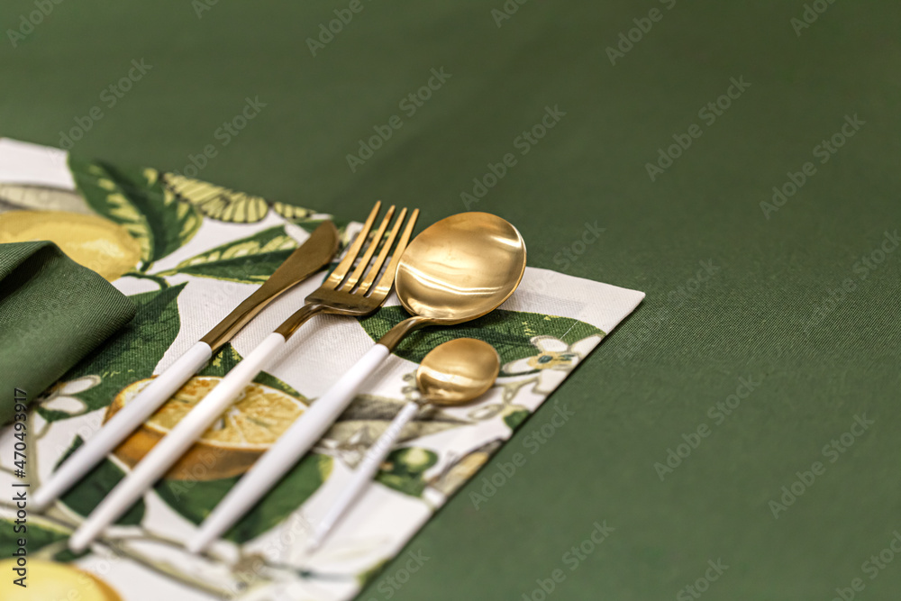Close-up of a set of cutlery on a served table. Close-up of a set of cutlery on a served table.