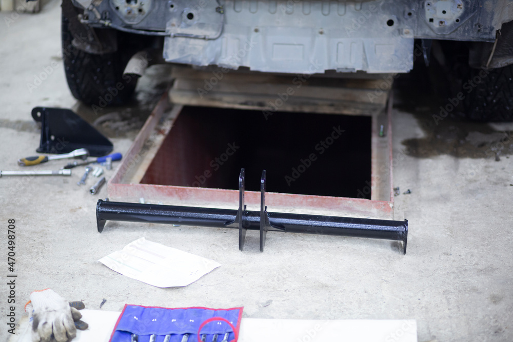 Tow bar for the car.Installing the towbar of the car . Stock Photo