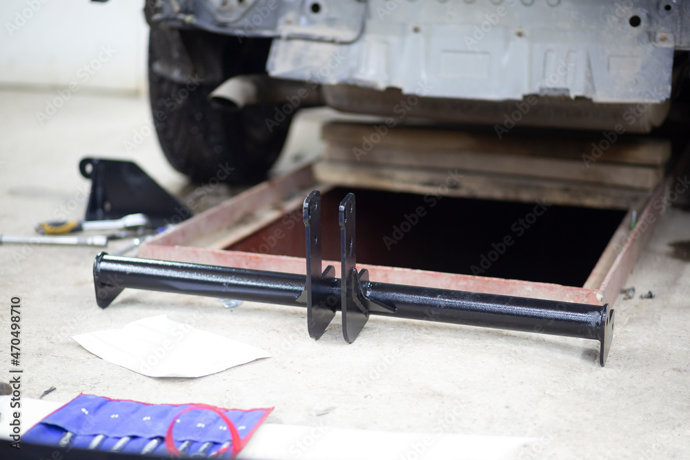 Tow bar for the car.Installing the towbar of the car .