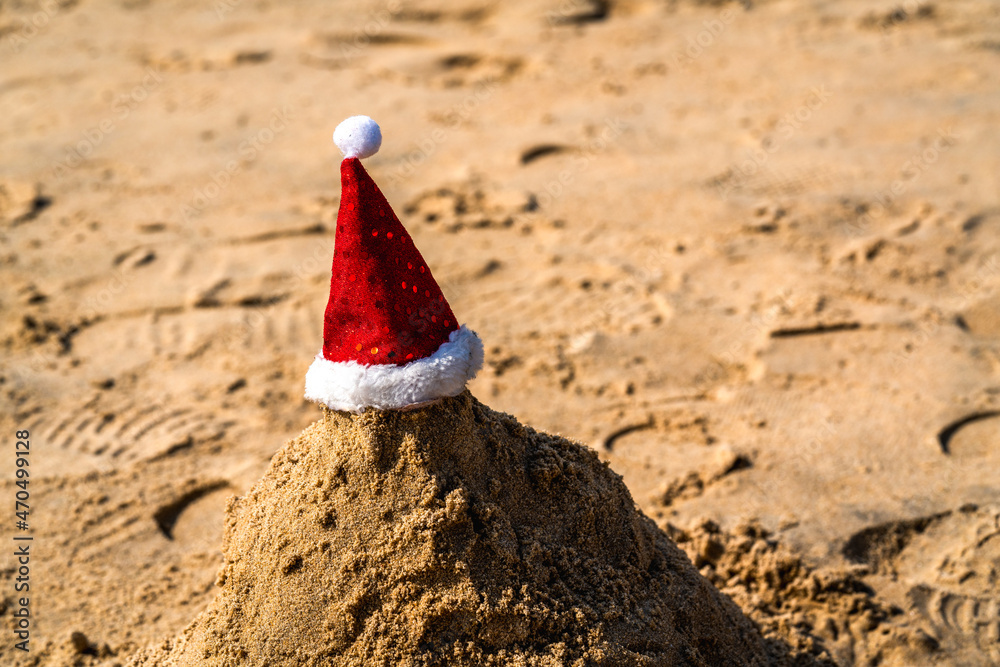 Christmas hat on the background of the beach Christmas hat on the background of the beach