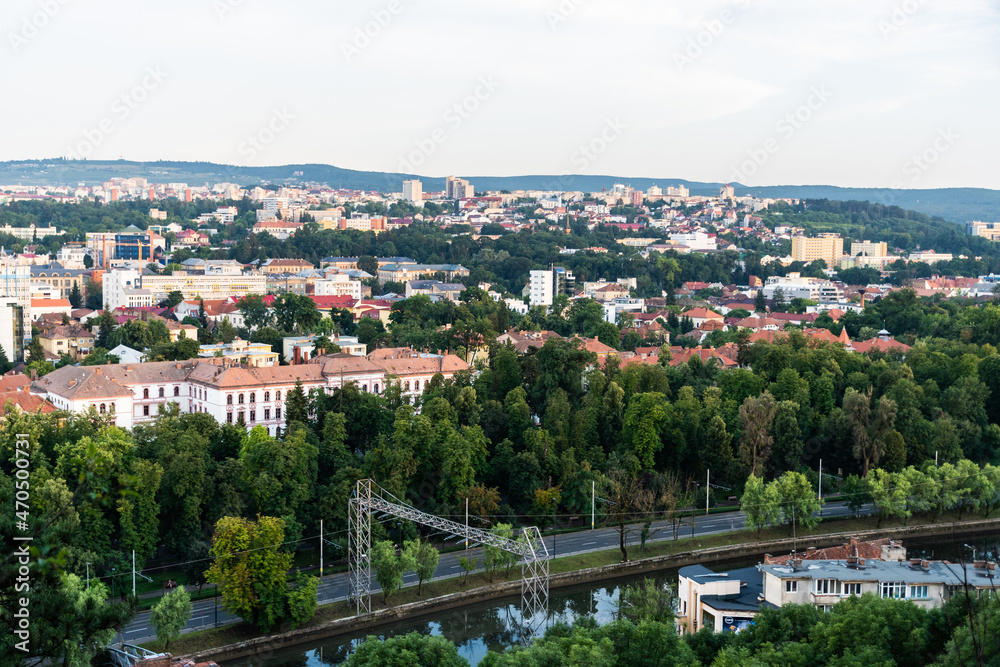 Aerial view over the city with the Splaiul Independentei street and Somesul Mic river, Babes Bolyai university and other buildings. Cluj Napoca, Romania.