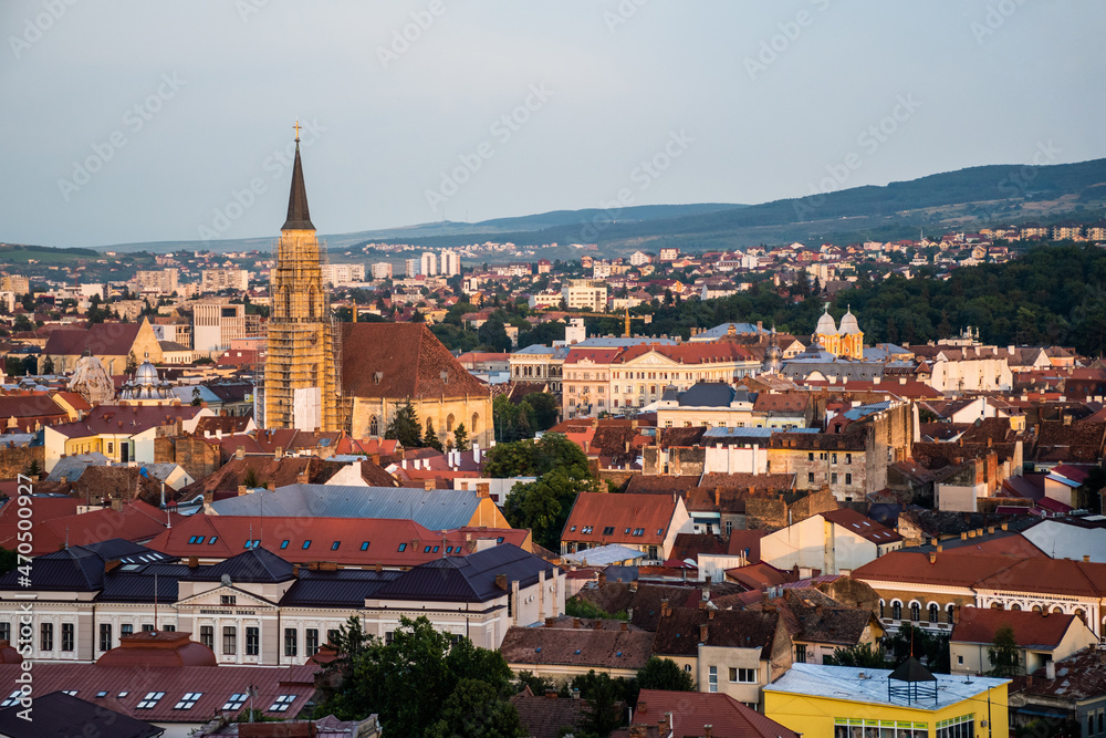 Aerial view over the city with the St Michael romano-catholic church and other buildings. Cluj Napoca, Romania.