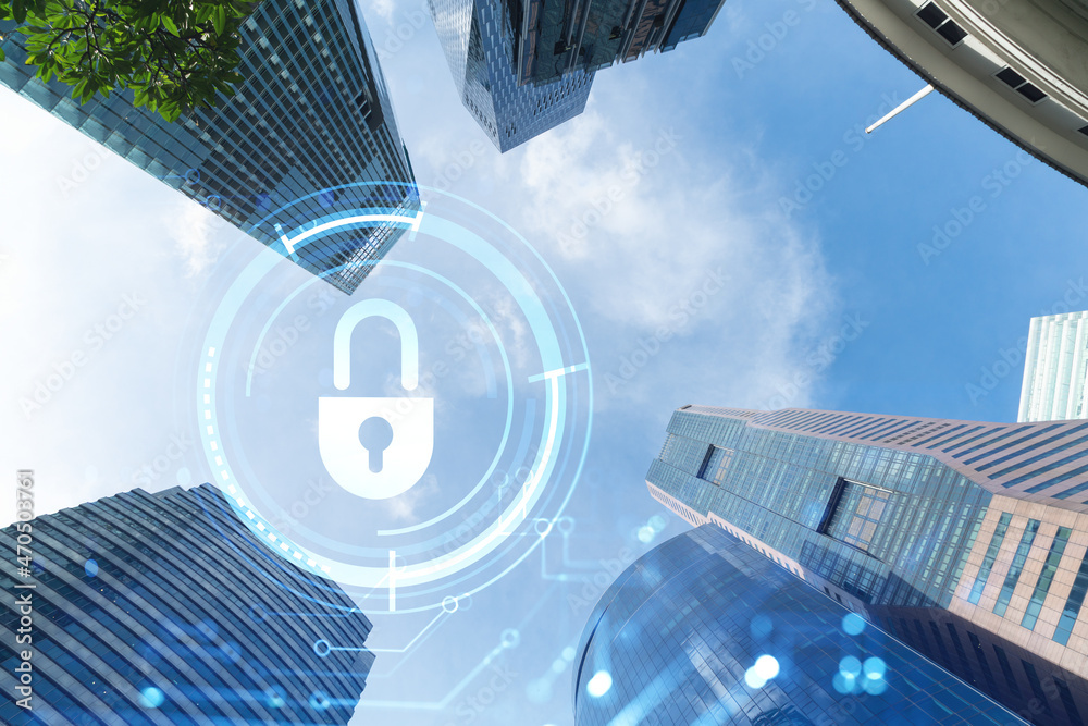 Hologram padlock icons symbolize the business protection in Asia over low angle shot of Singapore skyscrapers. The concept of information security shields. Double exposure. Hologram padlock icons symbolize the business protection in Asia over low angle shot of Singapore skyscrapers. The concept of information security shields. Double exposure.