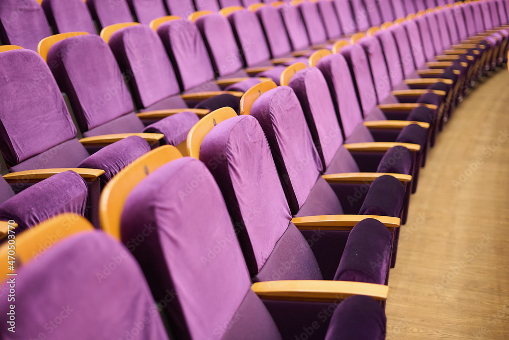 Obraz premium Upholstered chairs in an empty concert hall. Pandemic