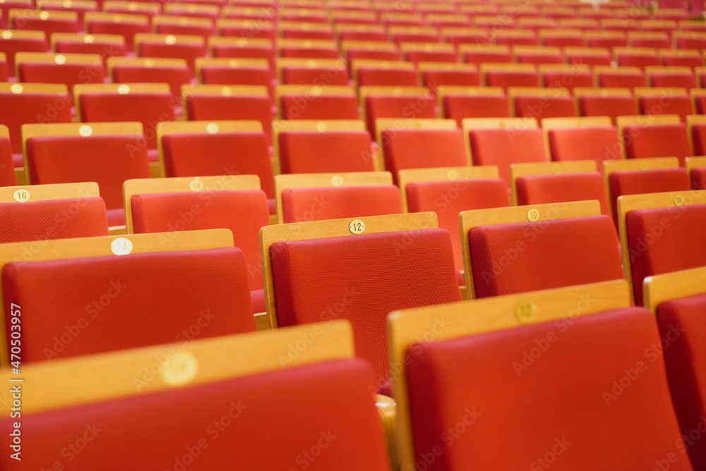 Fototapeta premium Upholstered chairs in an empty concert hall. Pandemic