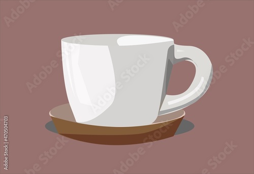 White kitchen cup for coffee and tea on a brown saucer.