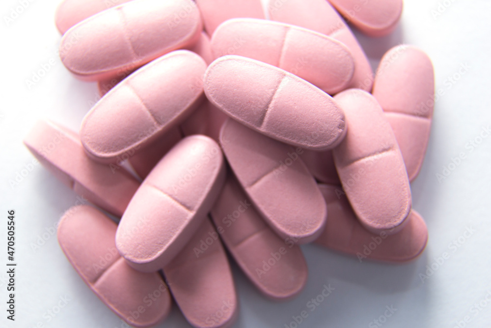 pink pills isolated on a white background pink pills isolated on a white background