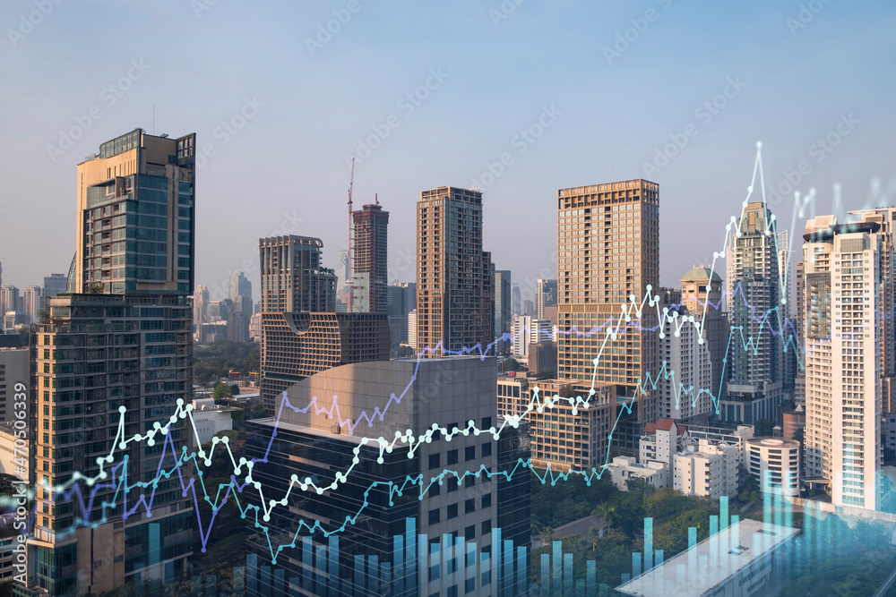Fototapeta premium Market behavior graph hologram, sunset panoramic city view of Bangkok, popular location to achieve financial degree in Southeast Asia. The concept of financial data analysis. Double exposure.