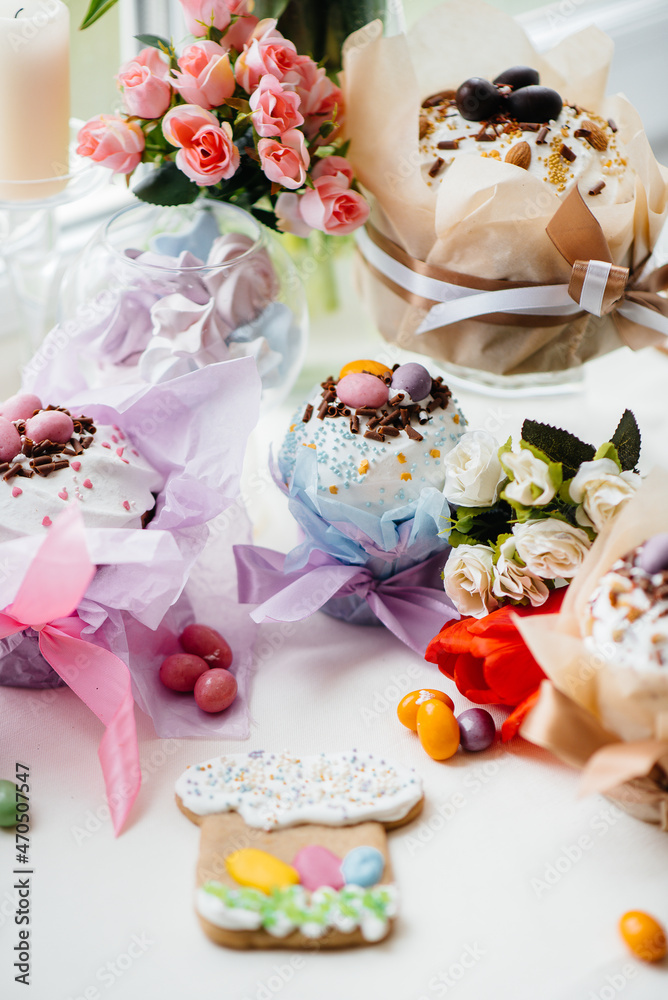 Beautiful Easter cakes with Easter eggs on a decorated light table. Bright Easter holiday. Beautiful Easter cakes with Easter eggs on a decorated light table. Bright Easter holiday.