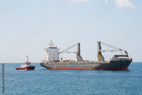 Cargo ships at sea at sunny day