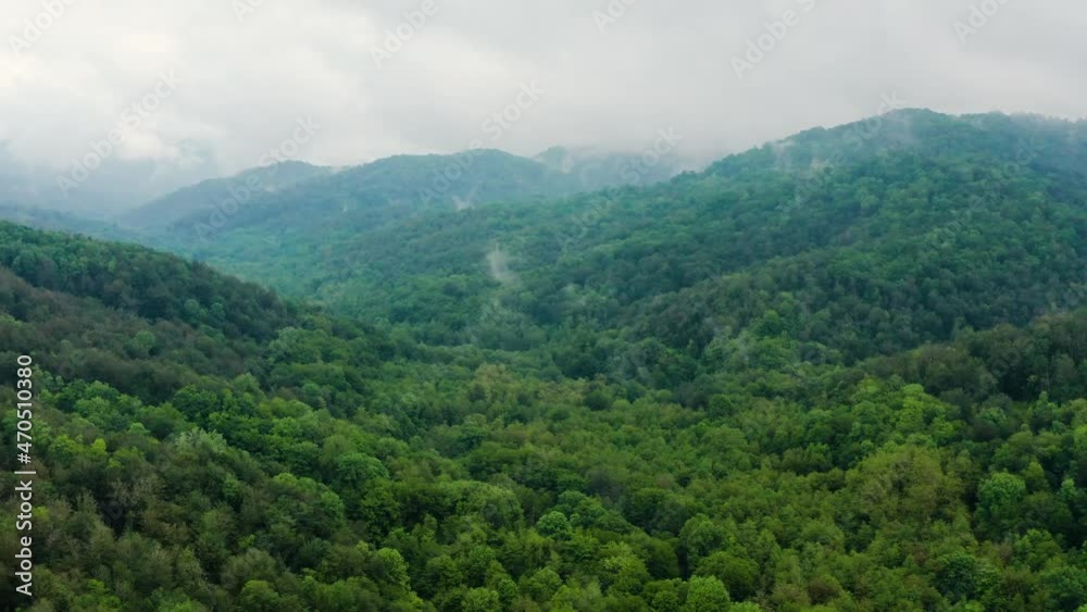 Caucasus Mountains, Akhun mountain range. Navalishinsky Canyon (White rocks). The valley of the Bolshaya Khosta River in fog. Aerial view. Caucasus Mountains, Akhun mountain range. Navalishinsky Canyon (White rocks). The valley of the Bolshaya Khosta River in fog. Aerial view.