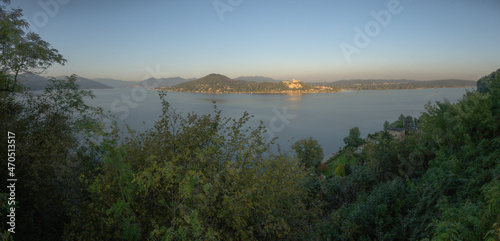 Vászonkép View across Lago Maggiore from Arona showing the Rocca di Angera castle