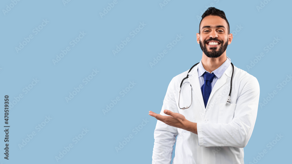 Happy Arabic Doctor Man Smiling Showing Copy Space, Blue Background Happy Arabic Doctor Man Smiling Showing Copy Space, Blue Background