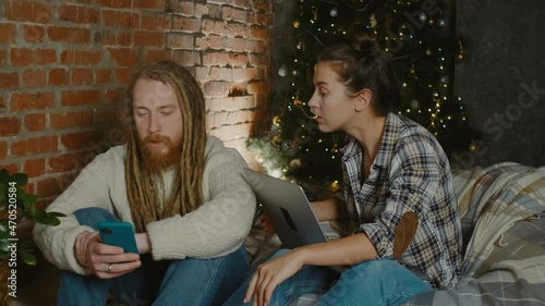 Couple having a video call during christmas holidays. Separated family members but connected during X-mas. Social distance