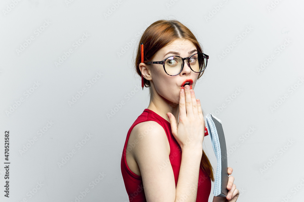 woman secretary in glasses with a notebook in the hands of the manager woman secretary in glasses with a notebook in the hands of the manager