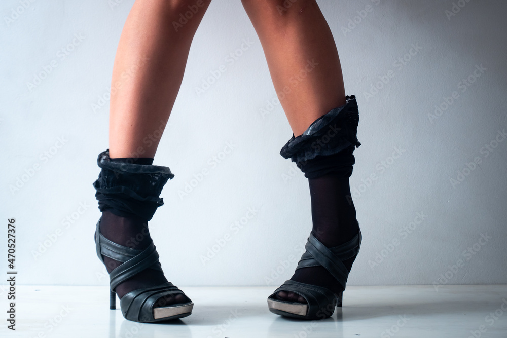 A Brunette Woman with Short Legs and Knees Together is Standing on a in White Background A Brunette Woman with Short Legs and Knees Together is Standing on a in White Background