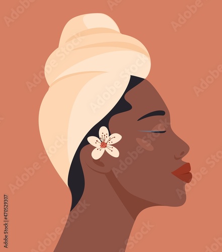 Portrait of beautiful black woman. Young african american girl face. Side view of head in traditional turban or wrap. Trendy vector abstract cartoon flat illustration. Isolated on a beige background.