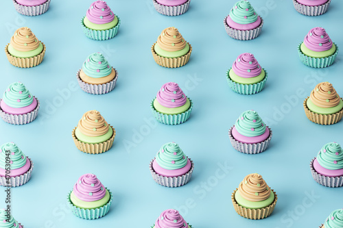 Foto Creative rainbow cupcake pattern on blue background