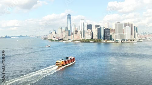 Staten Island Ferry to New York City. South ferry terminal. Aerial Manhattan drone skyscrapers. NYC holidays tourists visit USA, American urban destination. 