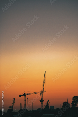 Sunset over cranes in Stockholm Sweden 20210721. High quality photo