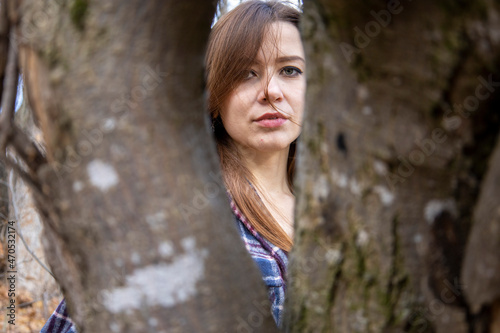 Beautiful girl in the woods near the trees © Олег Мальшаков