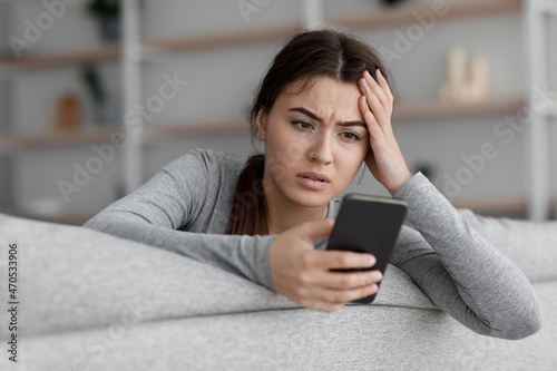 Slika na platnu Sad frustrated shocking european young woman suffering from depression and readi