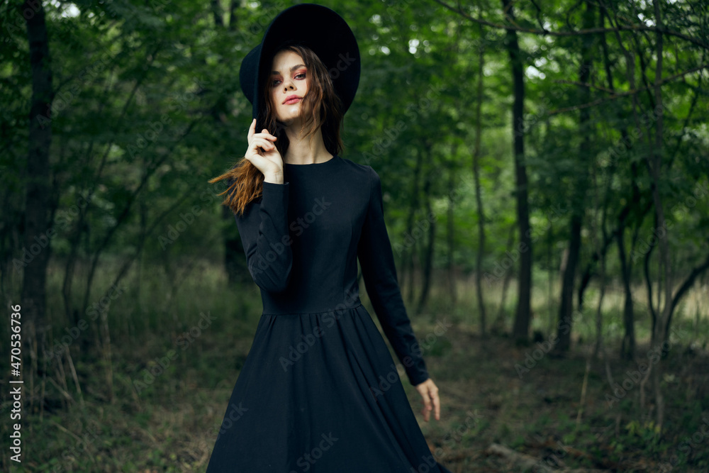 cheerful woman witch in the forest posing fantasy