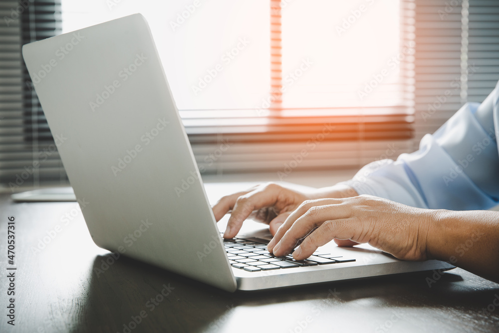 Woman hands are using a computer notebook Woman hands are using a computer notebook