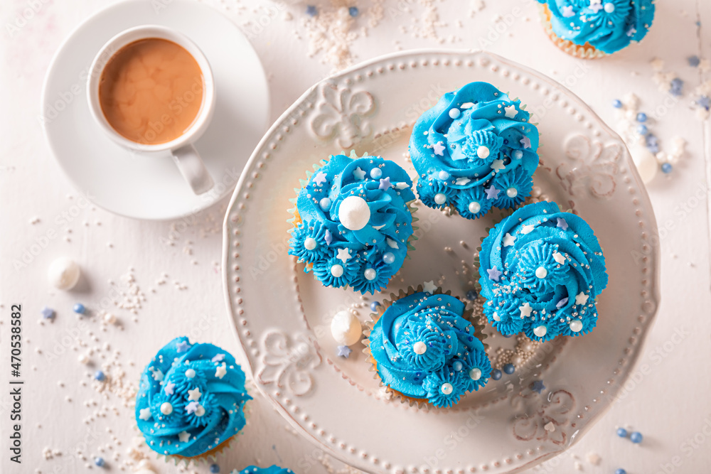 Unique blue cupcakes with cream and sprinkles for fat thursday. Unique blue cupcakes with cream and sprinkles for fat thursday.