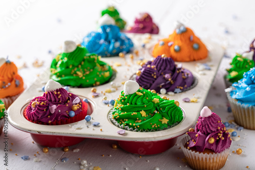 Unique multicolored cupcakes made of cream for fat thursday. photo