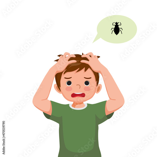 Cute little boy with lice infection on hair scratching his itchy scalp and head.