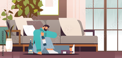 unhappy sad man drinker with bottles alcoholic drinking alone depressed addicted drunk guy having problem alcohol addiction
