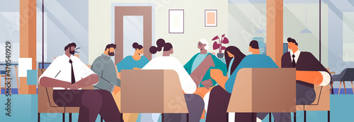 mix race people communicating while sitting in circle therapy group meeting addiction treatment concept