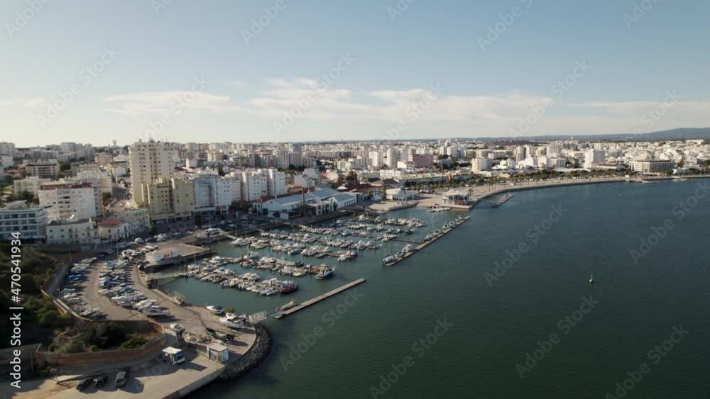 Portimao port against riverside, Portimao cityscape. Algarve vacations concept Portimao port against riverside, Portimao cityscape. Algarve vacations concept