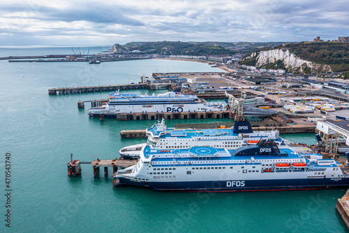 Aerial view of the Dover harbor with many ferries and cruise ships entering and exiting Dover, UK.