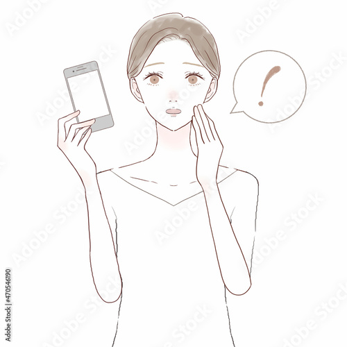 スマホを持って驚いている女性